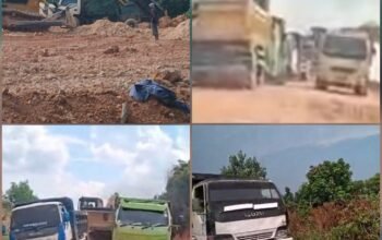 Truk pengangkut tanah urug hilir mudik di Jalan Utama Sei Binti, Sagulung, Batam.