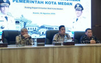 Plh Sekda Erfin Fahrurrazi buka sosialisasi Permendagri No. 2 Tahun 2026 di Balai Kota Medan, hadir Kadis Kominfo Arrahmaan Pane dan Ketua KISumut Abdul Harris Nasution — DANews.id