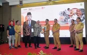 Pj Sekda Kota Medan Erfin Fahrurrazi saat membuka Workshop Digital Entrepreneurship di Hotel Grandhika Medan.