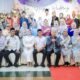 Zakiyuddin Harahap menyerahkan buku nikah kepada pasangan pengantin dalam nikah massal di Medan